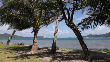 Bora-Bora-trees-a-cruise-ship-is-anchored-in-the-lagoon