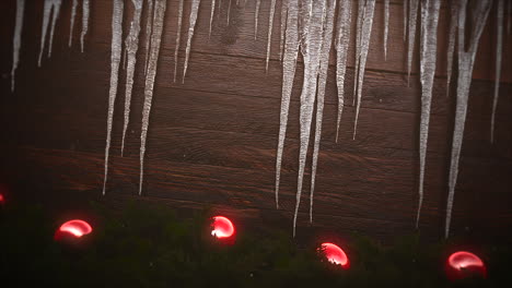 Animated-closeup-red-balls-and-icicles-on-wood-background-2