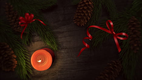 Animated-closeup-Christmas-candle-and-green-tree-branches-4