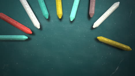 Closeup-colorful-chalk-on-blackboard-school-background-3