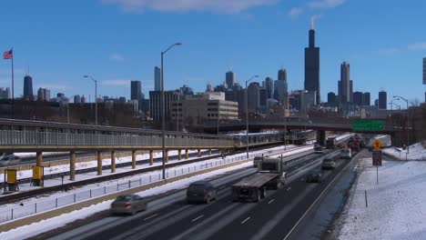 Cars-travel-on-a-freeway-into-Chicago-in-winter