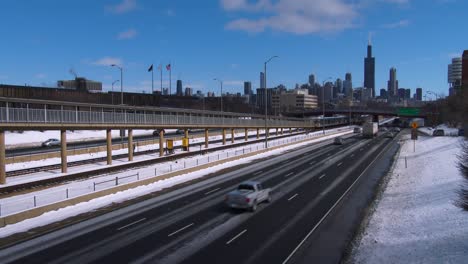 Cars-travel-on-a-freeway-into-Chicago-in-winter-1