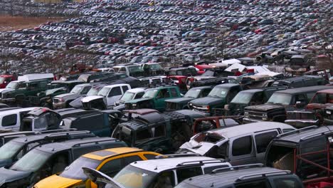 Cars-sit-in-rows-in-a-junkyard-in-the-snow-1