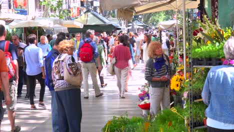 Crowds-walk-in-a-neighborhood-in-Barcelona-Spain-1