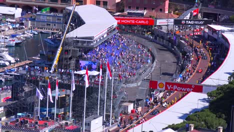 Grand-Prix-cars-pass-the-grandstands-at-the-finish-line-of-the-Monaco-race