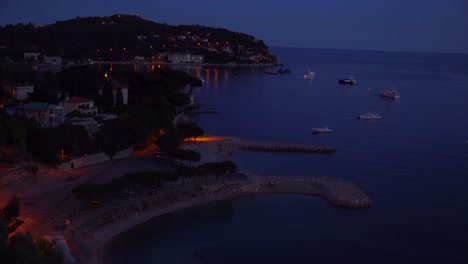 High-angle-over-France's-amazing-Cote-D'Azur-at-night-1