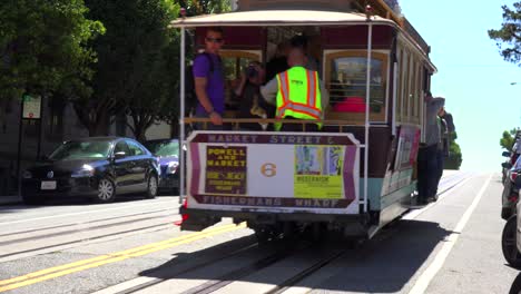A-cable-car-goes-up-a-hill-in-San-Francisco