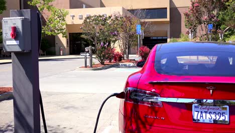 A-Tesla-electric-car-charging-in-front-of-Tesla-corporate-headquarters