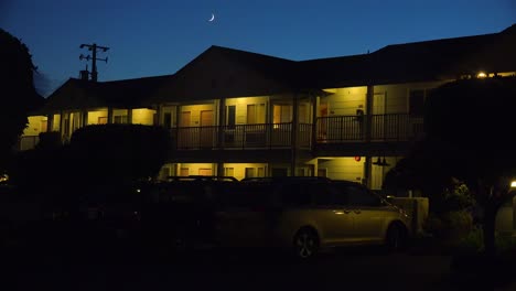 A-modern-economy-hotel-exterior-establishing-shot-at-night