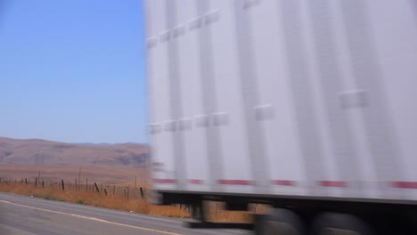 An-unmarked-truck-carries-freight-through-the-desert