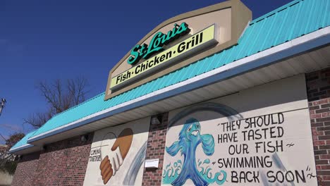 Graffiti-messages-are-left-on-a-boarded-up-KFC-following-the-rioting-in-Ferguson-Missouri-2