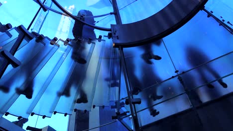 An-abstract-shot-of-people-walking-on-a-frosted-staircase-1