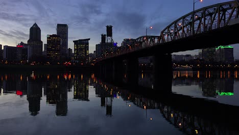 Evening-shot-of-a-bridge-over-the-Willamette-River-with-Portland-Oregon-background