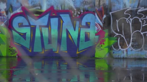 Focus-through-a-chain-link-fence-to-reveal-urban-graffiti