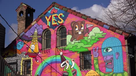 Urban-graffiti-decorates-a-building-painted-with-YES-in-Portland-Oregon