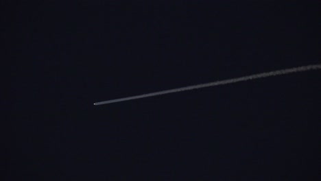 A-UFO-asteroid-or-rocket-moves-across-the-night-sky-leaving-a-bright-trail-behind