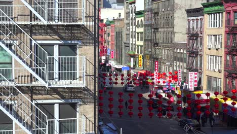 Establishing-high-angle-shot-of-an-apartment-in-the-Chinatown-district-with-lamps-and-lanterns-in-New-York-City