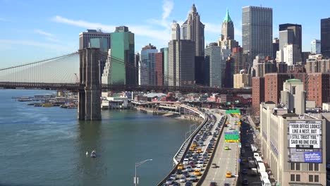 The-Brooklyn-Bridge-East-River-and-FDR-parkway-on-a-clear-sunny-day-in-New-York-City-4