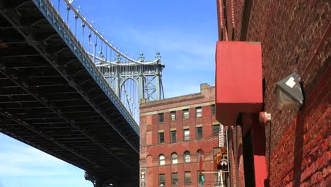 An-establishing-shot-of-the-Dumbo-area-of-Brooklyn-New-York-including-the-Brooklyn-bridge-1