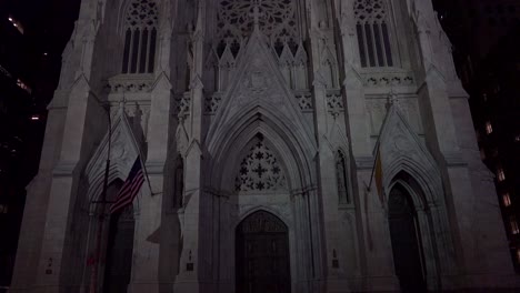 Tilt-down-to-New-York's-magnificent-gothic-St-Patrick's-cathedral-at-night