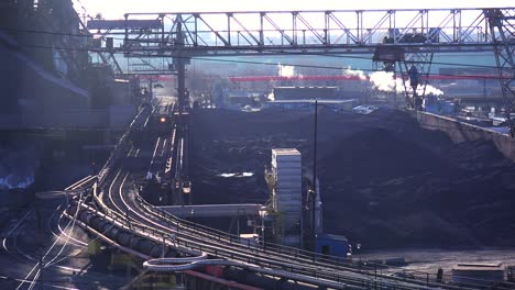 Establishing-shot-of-a-busy-steel-mill-with-ore-transported-through-an-aerial-skyway