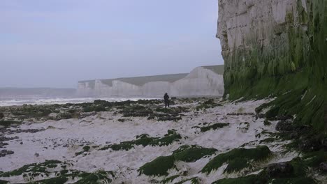 A-distant-woman-walks-along-the-White-Cliffs-of-Dover-near-Beachy-Head-in-Southern-England-1