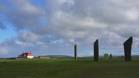 The-sacred-Brodgar-circular-Celtic-stones-on-the-Islands-of-Orkney-in-Northern-Scotland-with-farm-background