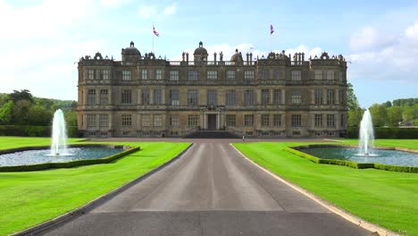 Establishing-shot-of-the-Longleat-mansion-in-England-amidst-green-lawns-and-fountains-1