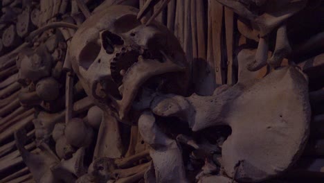 Skulls-and-bones-hang-from-the-walls-at-the-Sedlec-Ossuary-in-the-Czech-Republic