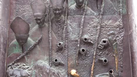 A-unique-metal-door-sculpture-in-ljubljana-Slovenia-features-the-Pope