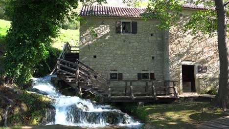 A-waterfall-flows-beside-an-old-mill-in-Croatia-