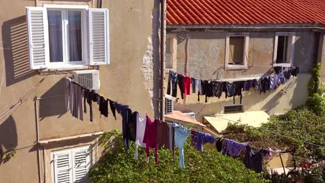 Laundry-hangs-outside-a-decaying-villa-in-Europe