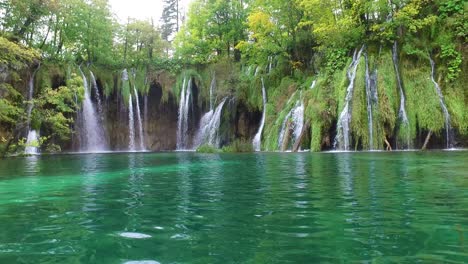 Beautiful-waterfalls-flow-through-lush-green-jungle-at-Plitvice-National-Park-in-Croatia-11