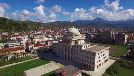 Beautiful-aerial-shot-over-large-capital-dome-or-government-building-at-Berat-Albania
