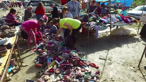 Moving-POV-shot-through-a-large-outdoor-flea-market-in-the-Alps-of-Albania