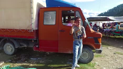 Moving-POV-shot-through-a-large-outdoor-gypsy-flea-market-in-the-Alps-of-Albania