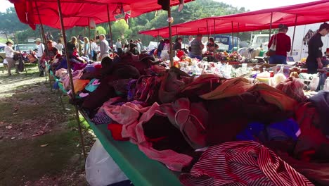 Moving-POV-shot-through-a-large-outdoor-gypsy-flea-market-in-the-Alps-of-Albania-1