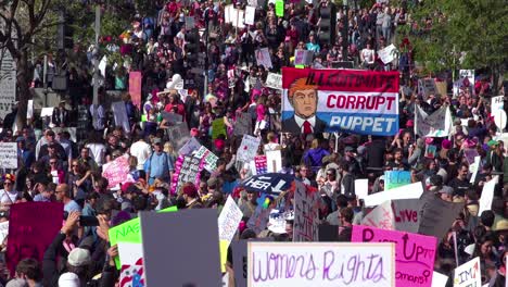A-huge-protest-against-the-presidency-of-Donald-Trump-in-downtown-Los-Angeles-identifies-the-President-as-a-corrupt-illegitimate-puppet