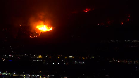 Out-of-control-wildfire-burns-behind-a-California-city-at-night-1