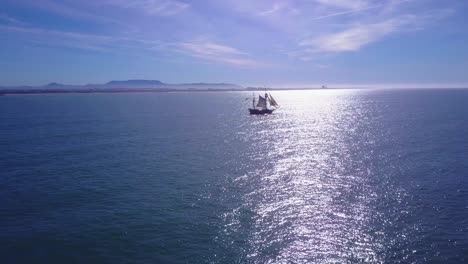 Spectacular-aerial-following-a-tall-sailing-ship-on-the-open-ocean-by-day-8