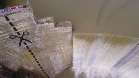 Beautiful-aerial-over-a-high-waterfall-or-dam-in-full-flood-stage-near-Ojai-California-5
