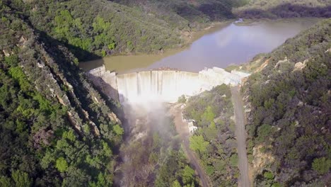 Beautiful-aerial-over-a-high-waterfall-or-dam-in-full-flood-stage-near-Ojai-California-15