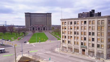 Aerial-past-derelict-buildings-reveals-the-exterior-of-the-abandoned-central-train-station-in-Detroit-Michigan-1