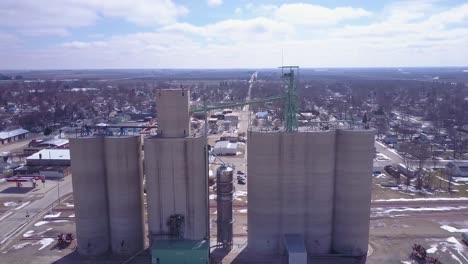 An-aerial-over-a-grain-silo-reveals-a-small-American-Midwest-farming-town