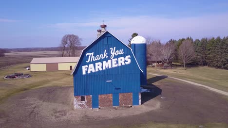 Aerial-over-a-rural-barn-which-says-Thank-You-Farmers