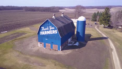 Aerial-over-a-rural-barn-which-says-Thank-You-Farmers-1