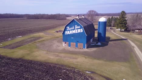 Aerial-over-a-rural-barn-which-says-Thank-You-Farmers-3