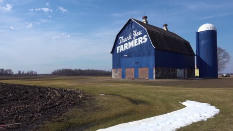 Low-angle-of-a-rural-barn-which-says-Thank-You-Farmers