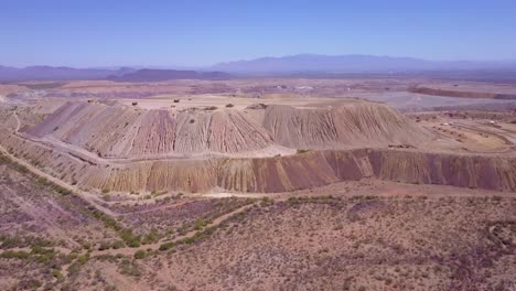 An-aerial-over-a-vast-open-pit-strip-mine-in-the-Arizona-desert