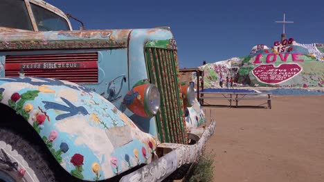 A-truck-painted-with-Bible-verses-and-promoting-Jesus-sits-at-a-Christian-hippy-commune-at-Slab-City-California-2